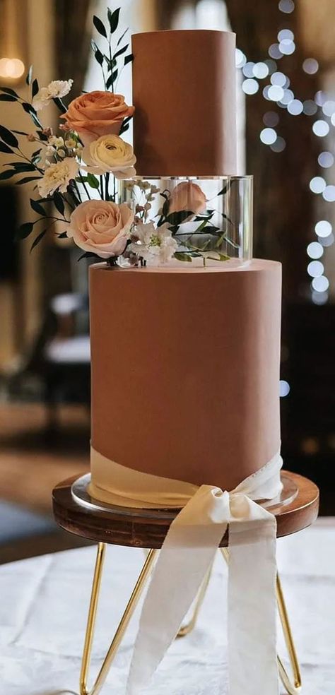 50 Beautiful Wedding Cakes in 2022 : Chocolate Wedding Cake Red White And Gold Cake Ideas, Brown Wedding Cake Ideas, Acrylic Tier Wedding Cake, Shades Of Brown Wedding Cake, Dream Wedding Cake Unique, Wedding Cake With Acrylic Tier, Cake With Acrylic Tier, 2024 Wedding Cake, Wedding Cake Brown