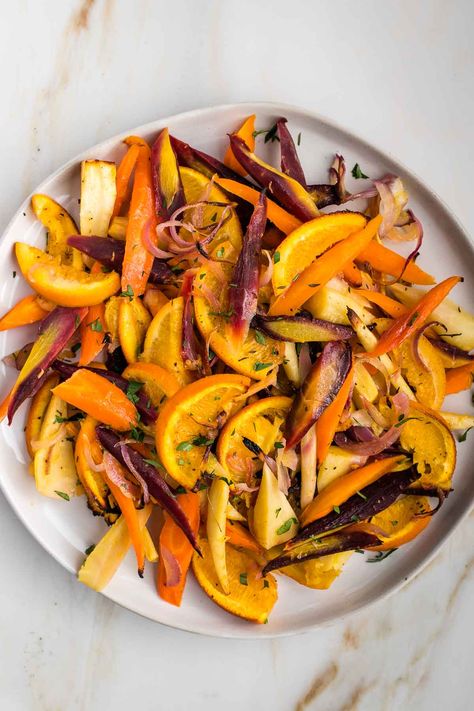 Looking for a delicious and healthy side dish? Try our honey roasted carrots and parsnips! These root veggies are roasted to perfection with a touch of honey, bringing out their natural sweetness and creating a delectable caramelized flavor. Perfectly crisp on the outside, tender on the inside, and bursting with flavor, these roasted parsnips and carrots are a great addition to any meal. Whether you're looking for a simple side dish or a something for special occasion, this is it! Side Veggie Dishes, Roasted Parsnips And Carrots, Roasting Carrots, Raw Cauliflower Salad, Parsnips And Carrots, Carrot Parsnip, Carrots And Parsnips, Roasted Carrots And Parsnips, Roasted Root Veggies