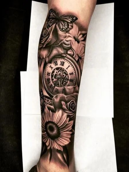 225 Clock Tattoos Ideas and Designs (2022) - TattoosBoyGirl Stop Watch Tattoo For Women, Roman Numeral Clock Tattoo, Clock Tattoo Design Women, Clock Tattoos For Women, Stop Watch Tattoo, Clock Face Tattoo, Mary Tattoos, Time Piece Tattoo, Clock Tattoo Sleeve