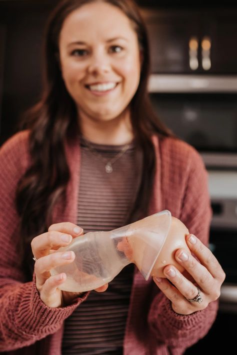 Woman holding Haaka pump to demonstrate how to position breast for clogged duct relief Clogged Milk Duct, Haakaa Pump Tips, Haakaa Pump Clogged Duct, How To Use Medela Hand Pump, Dangle Feeding For Clogged Duct, Clogged Duct, Bacterial Infection, Hand Pump, Baby Prep