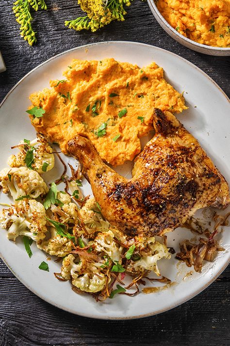 Nothing says comfort food like this roasted lemon chicken and hearty roasted cauliflower with creamy mashed sweet potatoes. Served with a sprinkle of crispy fried shallots, you'll be licking your plate clean! Seasoned Cauliflower, Roasted Lemon Chicken, Mashed Sweet Potato, Roast Chicken Dinner, Sweet Potato Mash, Spatchcock Chicken, Mash Recipe, Hello Fresh Recipes, Onion Gravy