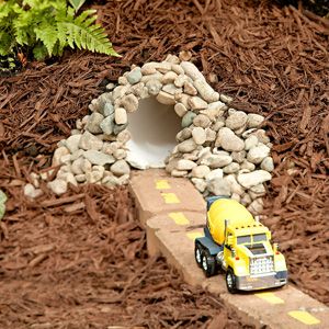 Great ideas (with How To's) to transform a corner of your yard into a playtime paradise for kids with quick-and-easy projects that include a toy car road, a sandbox, and more. - (I'm thinking - a great addition to a fairy, or gnome or frog for boys, garden) Diy Toys Car, Play Area Backyard, Backyard Activities, Outdoor Play Area, Activities For Boys, Yard Project, Ideas Backyard, Outdoor Classroom, Backyard Play