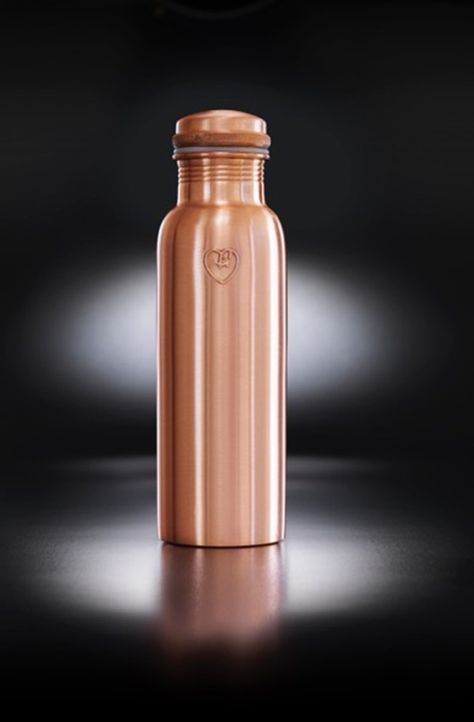 Copper metal water bottle in a smooth matte texture. The "Athlete" bottle has an extra wide mouth so you can drink easily and pop ice cubs inside. The pure copper naturally charges to water with antioxidant, anti-inflammatory and anti-microbial properties. This helps ease digestive and joint ailments, improves red blood cells, helps regenerate skin cells and more! Also available in hammered texture, all on Chalk & Moss (chalkandmoss.com). Copper Bottle, Pop Ice, Copper Water Bottle, Copper Vessel, Perfume Ad, Metal Bottle, Metal Water Bottle, Biophilic Design, Metal Bottles