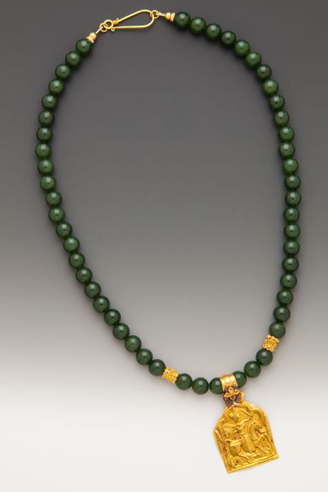 An antique 20K-22K Indian protective plaque amulet of Bhumiya Raj on 8mm deep green jade (nephrite) beads with diamond and 18K accents. ElleSchroeder.com Jade Beads Necklace Indian, Beads Necklace Indian, Stone Bead Jewelry, Crystal Bead Jewelry, Pearl Necklace Designs, Necklace Indian, Antique Jewelry Indian, Gold Pendant Jewelry, Nephrite Jade