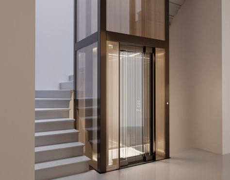 Stairs Lift Design, Stairs With Lift, Glass Elevator Design, Glass Elevator Design Interiors, Lift Wall Design, Lift Design Interior, Hotel Lift Lobby, Lobby Residential, House Elevator