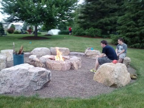 Big Rocks Landscaping, Round Fire Pit Ideas, Landscaping With Big Rocks, Boulder Fire Pit Ideas, Big Rocks In Landscaping, Fire Pit River Rock, Big Rock Landscaping Ideas, Unique Fire Pit Ideas, Fire Pit Large Rocks