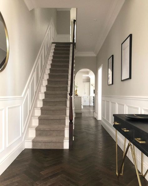 Rachael Somerville on Instagram: “Throwback Thursday ✨ Swipe to see what this view looked like mid reno ⬅️ As part of the renovation all of the floors at ground floor…” Dark Herringbone Floor, Stair Gates, Dark Timber Floors, Hallway Panelling, درج السلم, Stair Gate, Dark Panels, Narrow Hallway Decorating, Hallway Flooring