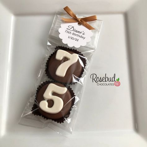 "PRODUCT DETAILS  * Eight (8) pairs of milk chocolate hand dipped Oreo cookie favors with a round or scallop \"75th BIRTHDAY\" tag.   Each package has two cookies, one with a \"7\" and one with a \"5\" (16 total cookies). * All cookies are placed in a paper cup, heat sealed in a cellophane bag and tied with satin ribbon. * Please let us know any details regarding your order including RIBBON COLOR, EVENT DATE and wording you would like on your favor tag.  PLACING YOUR ORDER  Our chocolate favors 75th Birthday Party Favors, Covered Oreo Cookies, 50th Birthday Party Favors, Oreo Cookies Dipped, Happy Birthday Tag, Cookie Party Favors, Homemade Wedding Favors, 75th Birthday Parties, Birthday Labels