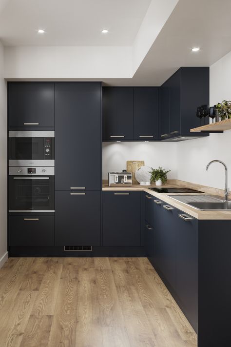 Embrace the trend for dark interiors with the bold shade of our Greenwich Navy kitchen cabinets. To create this bold kitchen design then pair with wood flooring for kitchen flooring ideas. With a slab design and matt finish the Greenwich range is perfect for a modern space. Navy Kitchen Cabinets, Stylish Small Kitchen, Blue Kitchen Designs, Navy Kitchen, Kitchen Decor Inspiration, Open Plan Kitchen Living Room, Blue Kitchen Cabinets, Art Deco Interior Design, Kitchen Room Design