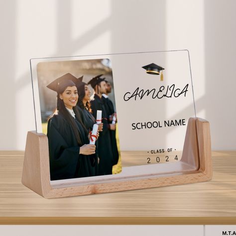 Personalized Graduation Gifts 🎓 Custom Acrylic Photo Frame Celebrate the achievements of your loved ones with our Personalized Acrylic Photo Frame, the perfect keepsake for graduation season! Product Details: Material: High-quality acrylic Customization Options: Name of the graduate Graduation date School name Suitable for: Her, Him, Friend Graduation Season Decorations: Class of 2024 Perfect for: Graduation Gifts 🎓 Keepsake to commemorate achievements 🏆 Home decor for a proud display 🏠 Features: Sleek and modern design that fits any decor style Clear acrylic that beautifully showcases your customizations Durable and long-lasting, a cherished memory for years to come How to Order: Enter the name of the graduate, graduation date, and school name in the personalization area. Ensure all d Graduation Frames, Graduation Souvenirs, Graduation Gift For Daughter, Acrylic Photo Frame, Season Decorations, Graduation Frame, Daughter Graduation, Friend Graduation, Acrylic Photo Frames