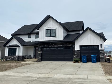 Black And White House With Stone, White House Black Trim With Rock, Grey And Black Stucco House, Black And Gray Stone Exterior, Dark Stone Exterior Houses, Gray And White House Exterior, Houses Painted Black, White And Black House Exterior, Black And White House Exterior