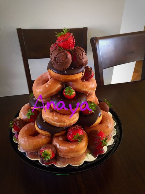 Donut cake tower Stacked Donut Cake Birthday, Cake Decorated With Donuts On Top, Doughnut Tower Birthday, Donut Stack Cake, Donut Cake Tower, Donut Tower Cake, Donut Towers, Donut Stack, Doughnut Wedding Cake