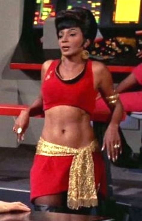 A little background she was in just about every episode of Star Trek; but when you enter Uhura atleast a third of the images are of this costume from the iconic episode "Mirror,Mirror". This actress actually helped NASA recruit women and minorities to become Astronauts in the Seventies and helped gather the cast (minus William Shatner) for the iconic image of them next to the shuttle Enterprise. Star Trek Actors, Fandom Star Trek, Mirror Universe, Star Trek Crew, Nichelle Nichols, Star Trek Cast, Star Trek Original Series, Star Trek Images, Star Trek Characters