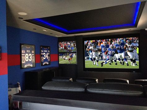 Glorious Game Nights: Best Sports-Themed Media Rooms and Home Theaters Sports Tv Room, 3 Tvs On One Wall, Tv Sports Room, Basement Sports Room, American Football Bedroom, Sports Theme Basement, Home Theatre Room Design, Small Home Theatre, Basement Theater Room Ideas