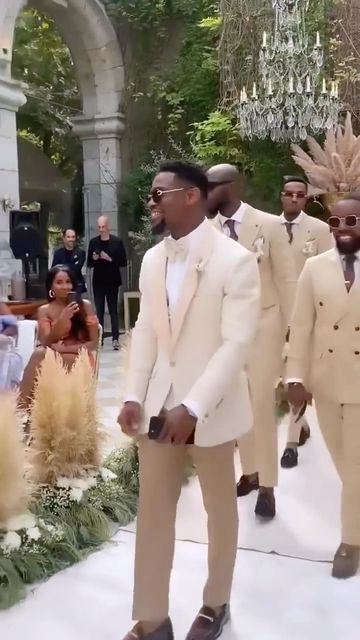 Everythingwedding Global on Instagram: "We love seeing y’all show love to the Groom and Groomsmen! It’s their day too!! ❤️ 💐 But we’re ready to see what the Ladies are looking like if this is just the beginning of the Wedding Party 🙌🏾 🎥 @mrtn.dbrh #groomsmen #groom #mensfashion #father #marriagegoals #instadaily #vows #baby #instagood #energy #reels #style #bridesmaids #happy #explorepage #blacklove . #explore #fashion #weddingphotography #luxury life #goodvibes #trending #photooftheday #vi Gold And White Groom Suit, Cream Wedding Suit Black Man, Champagne Gold Groomsmen Attire, White And Gold Groomsmen Suits, White And Gold Wedding Groomsmen, Groomsmen Neutral Colors, Brown And Beige Wedding Theme, White And Gold Wedding Party, Groomsmen Attire Gold