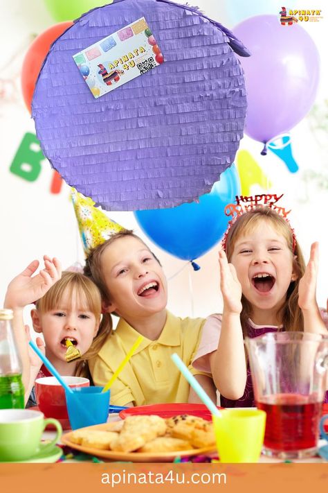 Three children at a colorful birthday party, wearing festive hats and smiling excitedly. A large purple circular piñata with a tag reading 'Apinata4u.com' hangs above them, while balloons and a banner spelling 'Birthday' decorate the background. The table is filled with snacks, cups, and juice. Circle Pinata, Pinata Diy, Orange Lavender, Diy Pinata, Color Circle, Accessories Ideas, Diy Party Decorations, Diy Party, Yellow Blue