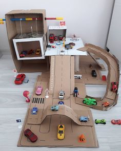 Car Tracks For Kids Diy, Cardboard Race Track, Kids Race Track, Car Tracks For Kids, Cardboard City, Cardboard Crafts Kids, Cardboard Car, Art Activities For Toddlers, Non Toy Gifts