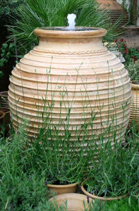 Convert a large LAMP base into an outdoor fountain! http://landscaping.wonderhowto.com/how-to/build-pot-fountain-328630/ Home Plans With Courtyard, Olive Pot, Mediterranean Garden Ideas, Pot Fountain, Lavender Growing, Container Garden Recipes, Water Butts, Greek Garden, Mediterranean Garden Design