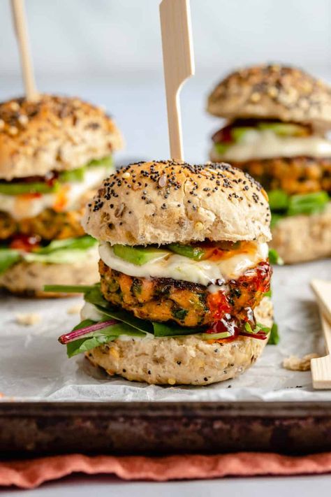 These blackened salmon sliders are packed full of flavour with quinoa and cajun spices, they make the perfect appetizer for any party or gathering. Whether it's for game day snacks or just hanging out with your friends at the weekend. These salmon sliders are juicy and utterly delicious and they are so quick and easy to throw together too. Be sure to serve with lime mayo and chilli jam for the ultimate flavour packed snack for your event. | eatloveeats.com Spicy Baked Chicken Wings, Salmon Sliders, Super Bowl Snack, Spicy Baked Chicken, Salmon Appetizer, Cajun Salmon, Crispy Baked Chicken Wings, Crispy Sweet Potato Fries, Blackened Salmon