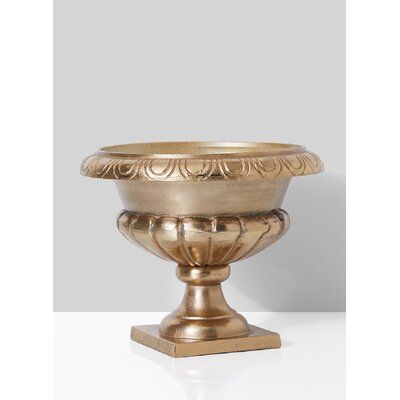 Astoria Grand This urn has all the classic details, including scalloped detail at the bowl, and a beatifully etched curved rim. Our aluminum urn has a beautiful light gold finish that gives it a rich and glamorous look. The all-metal construction in our classic silver-plated aluminium urn ensures it will look great and last a long time. Most people will use the urn to hold artificial flowers, but it also works for cut flowers as a table centerpiece or on a bookshelf. Ideal for wedding or event c Gold Urn, Event Centerpieces, Outdoor Urns, Flower Urn, Event Centerpiece, Urn Planters, Small Christmas Trees, Affordable Decor, Sorrento