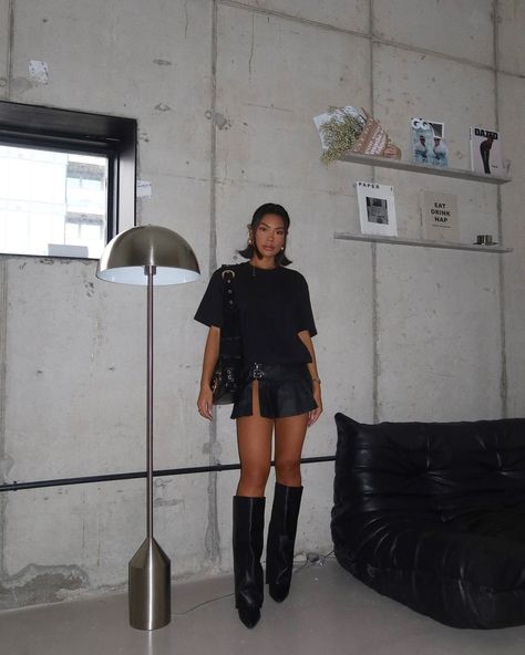 MONOCHROMATIC VIBES 🖤🕷 @x_carms in our Cotton Black Oversized T-Shirt, Black Coated Denim Buckle Detail Ultra Mini Skirt and Black Wide Fit PU Fold Over Knee High Block Heeled Western Boots 👀 Shop via the link in our bio 🔗 Black Skirt Knee High Boots, Wide Boots Outfit, Folded Boots Outfit, Denim Skirt And Boots Outfit, Fold Over Boots Outfit, Denim Skirt With Boots, Buckle Boots Outfit, Black Boots Outfits, Black Over The Knee Boots Outfit