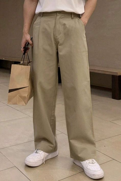 These men's straight-leg pants are made from cotton, have a wide leg, and have a zipper and button closure. #men #pant #koreanstyle #koreanfashion Trousers Outfit Men Korean, Khaki Trousers Outfit Men, Khaki Trousers Outfit, Khaki Pants Outfit Men, Trousers Outfit Men, Khaki Pants Outfit, Pants Outfit Men, Trouser Outfit, Khaki Trousers