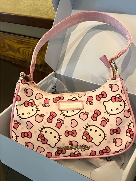 This Hello Kitty bag features a compact design with a convenient zipper closure, perfect for wearing over the shoulder. Crafted with comfortable non-adjustable straps and a side pocket, perfectly balanced for a chic style. All over print design Comfortable mini shoulder bag Perfect gift idea Y2k Things, Tapeta Hello Kitty, Hello Kitty Room Decor, Hello Kitty Gifts, Images Hello Kitty, Hello Kitty Purse, Hello Kitty Merchandise, Hello Kitty Rooms, Kitty Clothes