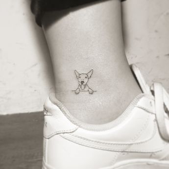 17 Insanely Cute And Tasteful Tattoos Small Dog Tattoo, Tatoo Dog, Small Dog Tattoos, Ankle Tattoo Small, Tasteful Tattoos, Arrow Tattoo, Subtle Tattoos, Foot Tattoo, Dog Tattoo