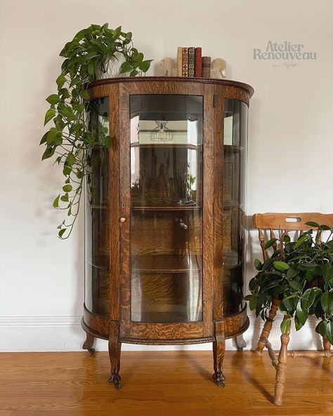 Restored antique curio cabinet made of quarter sawn oak #antique #antiquefurniturestyles #oak #oakfurniture #antiquehome Oak Curio Cabinet, Round Glass Hutch, Curio Cabinet Small, Curio Cabinet Aesthetic, Round China Cabinet, Curved Curio Cabinet, Mid Century Curio Cabinet, Small Vintage Cabinet, Plant Curio Cabinet