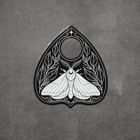 a white moth on black planchette surrounded by leaves and thorns. ✦ black and white shiny vinyl sticker ✦ transparent background! ✦ dishwasher safe and weatherproof for up to 4 years ✦ about 3.1 x 3.5 inches Bat Planchette Tattoo, Ouija Planchette Tattoo, Witch Doodles, Planchette Tattoo, Ouija Tattoo, Bunny Tracks, Moth Artwork, Sticker Transparent Background, White Moth