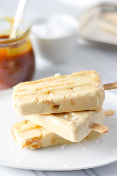 Salted Caramel Yogurt Popsicles | Platings + Pairings Salted Caramel Yogurt, Caramel Yogurt, Creamy Popsicles, Fruit Popsicle Recipes, Homemade Fruit Popsicles, Frozen Yogurt Popsicles, Vegan Popsicles, Frozen Yogurt Recipes, Healthy Popsicles