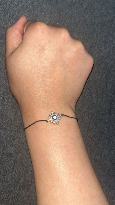 Black elastic band with gold or silver pendant with the evil eye on it. Evil Eye Beads, Cord Cover, Eye Beads, Eye Bracelet, Evil Eye Bracelet, Evil Eye, One Size Fits All, Anklets, Silver Pendant