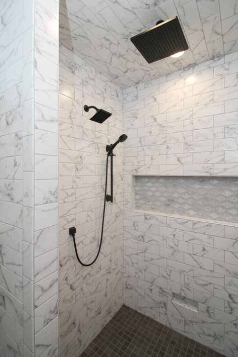 Marble Tile Shower Walls With Accent, Marble Shower With Black Floor, White Marble Shower Tile, Black And White Marble Shower Tile, Black Hexagon Tile Bathroom Floor Marble Walls, White Marble Shower Dark Floor, White Marble Shower Tile Black Floor, White Marble Shower, Bathroom Remodel Small Budget