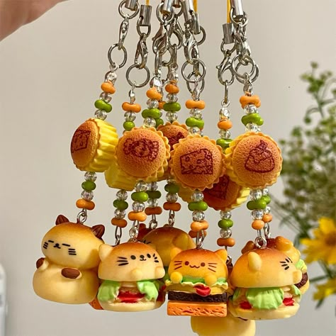 Cute Animal Hamburger Keychain Phone Strap Add a touch of cuteness and functionality to your keys or phone with our Cute Animal Hamburger Keychain Phone Strap. This charming accessory features a cute animal design with a hamburger charm. Perfect for animal lovers and those who appreciate adorable accessories on the go. Crochet Keychain Cute, Mango Keychain, Cute Clay Keychains, Cute Clay Things, Mini Clay Art Easy, Cute Keychain Ideas, Keychain Design Ideas, Clay Keychain Ideas, Craft Logo Design