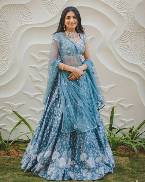 Wearing a blue bridal lehenga for your big day? These blue bridal lehengas will up your glamour quotient. Take cues. #blue #bluelehenga #bluecoloredoutfits #bluedresses #bridallehenga #bluebridallehenga #indianbrides #bridalwear #Lehengadesigns #indianwear #lehengainspiration #sabyasachilehenga #anitadongrelehenga #manishmalhotralehenga #shararadesigns #pakistanibrides #bridemaidslehenga #sangeetoutfit #haldioutfit #mehendioutfit #bridalmakeup #bridaljewellery #sequinslehenga Blue Bridal Lehenga, Lehenga Color Combinations, Sabyasachi Lehenga Bridal, Dupatta Draping, Latest Bridal Lehenga, Bridal Dupatta, Sabyasachi Lehenga, Blue Lehenga, Indian Wedding Wear