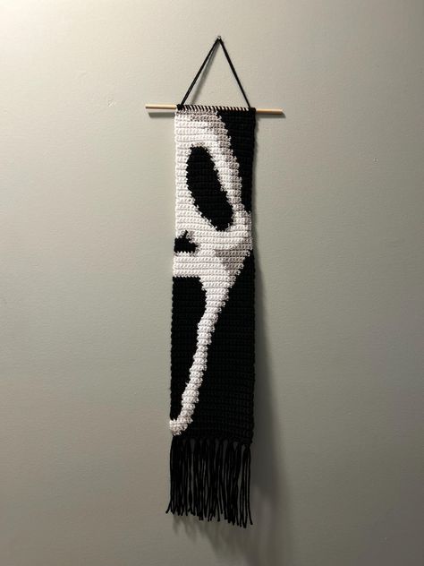 This is a finished item, not a pattern.  Halloween ghost crochet wall hanging.  Perfect for any Halloween movie lover.  The measurements are: -21in long not including the fringe  -26in long including fringe  -30.5in long from hook to fringe  -5.25in wide This wall hanging is made with acrylic yarn and has a wooden dowel rod. It is very lightweight and can hang from a nail, push pin, or anything you want to hang it from. Ghost Face Crochet Pattern, Halloween Crochet Tapestry, Ghost Face Crochet, Crochet Seasonal, Spooky Crochet, Ghost Crochet, Macrame Crafts, Crochet Wall Hanging, Crochet Holiday