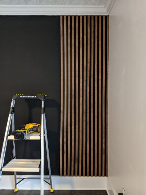 Wall Up And Down Lights, Dark Painted Wood Paneling, Wooden Slats Feature Wall, Wall Panel Coat Hanger, Slat Wall In Nursery, Wood Slat Dining Room, Narrow Slat Wall, Slat Wall In Dining Room, Wood Slat Wallpaper Ideas