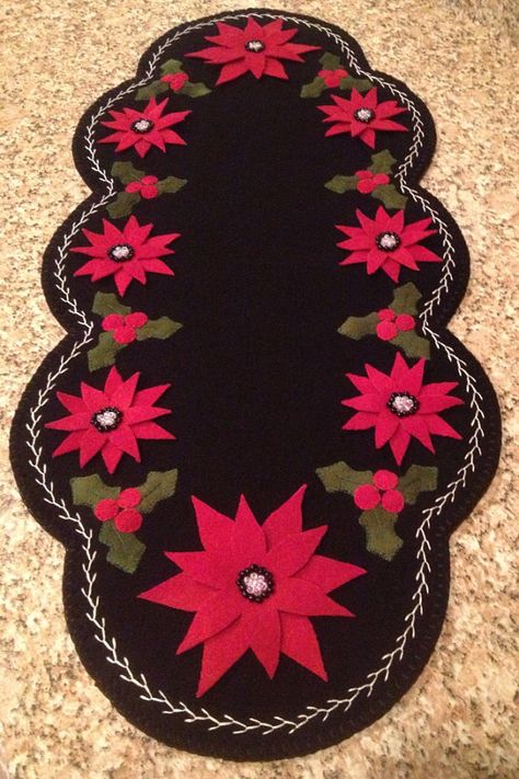 Primitive Wool Penny Rug Christmas Poinsettia with holly and berries on Etsy, $85.00 Felt Candle Mats, Penny Rug Patterns, Wool Felt Projects, Wool Applique Patterns, Felted Wool Crafts, Christmas Applique, Wool Quilts, Wool Embroidery, Penny Rug