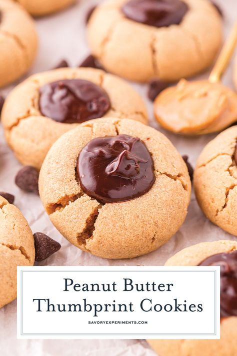 These Peanut Butter Thumbprint Cookies pair up moist peanut butter cookies with rich chocolate ganache for the ultimate cookie indulgence! Moist Peanut Butter Cookies, Butter Thumbprint Cookies, Homemade Ganache, Peanut Butter Thumbprint Cookies, Ganache Icing, Chocolate Ganache Recipe, Ultimate Cookies, Raspberry Cookies, Ganache Recipe