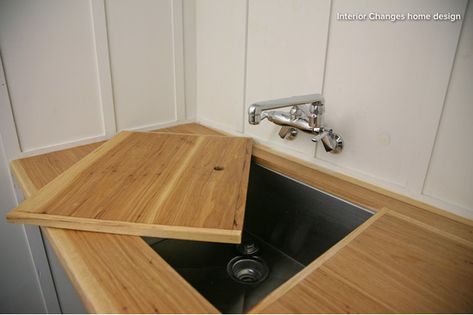 Sink topper for laundry room. Want a sink in your laundry room but don’t want to give up much-needed counter space? With a custom-fit sink cover like the one shown here, you can quickly transform your wash basin into a smooth surface for folding clothes. To get the most usable surface area, it’s best to choose a faucet that can pivot out of the way (like this one) rather than a fixed version. Laundry Designs, Compact Laundry Room, Laundry Folding Tables, Laundry Reno, Narrow Laundry Room, Laundry Nook, Hall Cupboard, Compact Laundry, Room Storage Diy