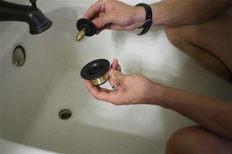 How to remove an old bathtub trim kit and replace with a new oil-rubbed bronze version. Replace Bathtub, Deep Clean Bathroom, Old Bathtub, Drain Repair, Refinish Bathtub, Bathtub Drain, Bathroom Update, Diy Home Repair, Diy Remodel