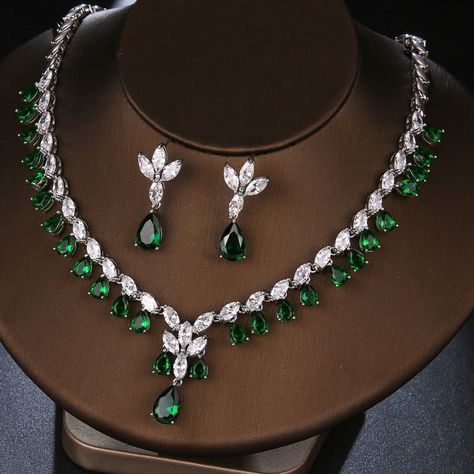 Make a stunning statement with this exquisite jewelry set, featuring a captivating emerald green cubic zircon necklace and earrings. Whether you're attending a wedding, a special event, or simply want to add a touch of sophistication to your ensemble, this set is the perfect choice. Key Features: Designed for the trend-conscious individual Elegant geometric shape and pattern Suitable for weddings and other special occasions Made of high-quality copper and adorned with shimmering cubic zirconia I Emerald Green Jewelry, Emerald Green Necklace, Diamond Jewelry Set, Zirconia Necklace, Cubic Zirconia Necklace, Cubic Zirconia Jewelry, Women's Jewelry Sets, Green Jewelry, Necklace And Earrings Set