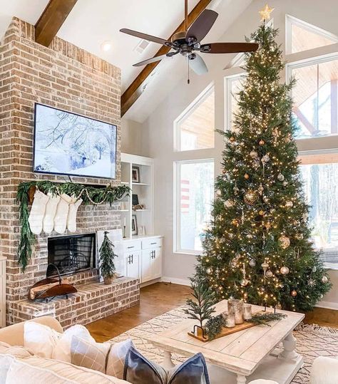 Tall Ceiling Living Room Christmas Tree, Vaulted Ceiling Living Room Christmas Tree, Vaulted Ceiling Christmas Tree, Brick Fireplace Tall Ceilings, Brick Fireplace Cathedral Ceiling, Vaulted Ceiling Christmas Decor, Christmas Tree In Front Of Window, Tall Brick Fireplace, Fireplace With Vaulted Ceiling