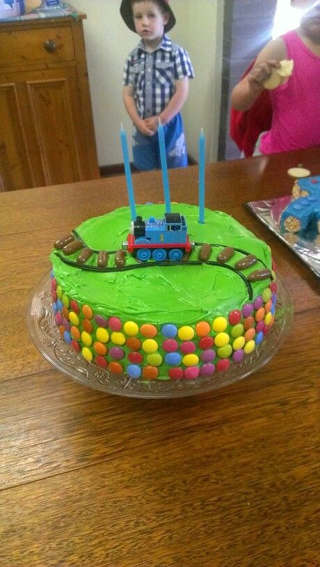 Easy boy train or Thomas birthday cake (use liquorice or icing gel for train track, plus choc liquorice bullets, then sit a train on top) Thomas Birthday Cake, Thomas Birthday Cakes, Ideas For Birthday Cake, Birthday Cake Kids Boys, Thomas Cakes, Train Birthday Cake, New Birthday Cake, Thomas Birthday, Train Cake