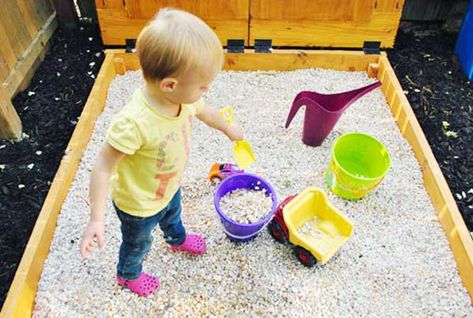 Switching from sand to a rock box with pea gravel... Might be easier to contain and deal with in the wet winter though harder to mold. Sandbox Alternative, Build A Sandbox, Rock Box, Indoor Playhouse, Build A Playhouse, Young House, Sand Play, Pea Gravel, Young House Love