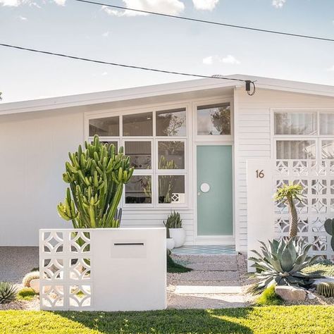 Adore Home Magazine on Instagram: "This is definitely my favourite before and after of my home - our front exterior and landscaping went through a big makeover. Here’s what we did:

- Reclad the front in brand new @jameshardieau Axon cladding and Linea weatherboards (it was previously clad in vinyl cladding with asbestos cladding underneath it)
- Replaced front door
- Restored the right hand side windows and replaced the left hand side windows with replica ones (due to a structural beam that had to go in the living room).
- Brand new driveway, steppers and concrete pad for our courtyard
- Built @thebreezeblockco privacy wall and custom built in @milkcanoutdoor letterbox 
- Re-tiled the front porch
- New plants! 

Fun fact, a previous home owner in the 90s hand made all of those hexagon pav Hexagon Pavers, Axon Cladding, Palm Springs Exterior, Vinyl Cladding, Palm Springs Homes, Mid Century Palm Springs, Palm Springs House, California Beach House, Palm Springs Home