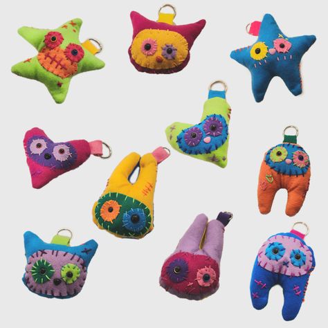 These adorable cuties are all hand made 1of1! They are sewn with felt by a mix of machine and by hand. They love to travel and all have their own name and birthday! They are all made at random so you will be receiving a unique design each time never to be remade. They are stuffed with poly-fill and metal O-Ring to hang on your items! Dimensions: Range from 3.5-6.5 Inches depending on the design! Size aside they are all mad with love!  Each package comes with wrapping, packaging filler, a sticker, and a small treat! Thank you so much! Funky Stuffed Animals, Hand Sewn Cat Toys, Hand Sewn Felt Animals, Felt Plush Ideas, Hand Sewn Keychain, Small Sewing Crafts, Needle Felt Keychain, Small Crafts To Sell, Hand Sewn Stuffed Animals