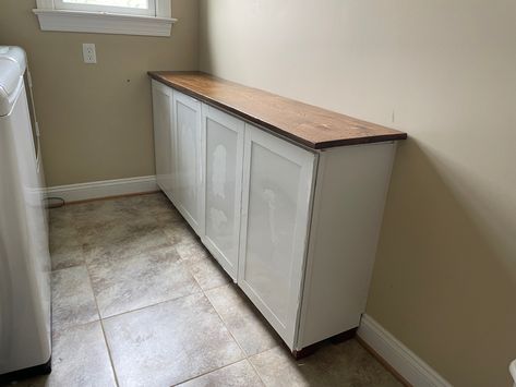 Transform a space with wall cabinets used as base cabinets and sofa feet. Looks custom! Upper Cabinets Used As Base, Using Top Cabinets As Base Cabinets, Shallow Base Cabinets, Laundry Room Base Cabinets, 12 In Cabinet Ideas, Top Cabinets As Base Cabinets, Using Wall Cabinets As Base Cabinets, Using Upper Cabinets As Base, Wall Cabinets As Base Cabinets