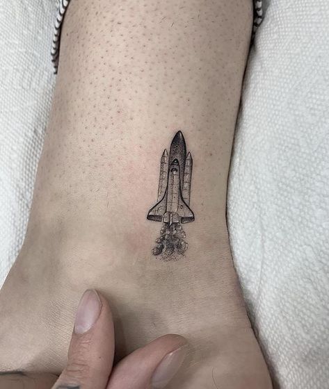 Rocket by Romeo Lacoste (@romeolacoste) from Los Angeles, USA, CA #usatattoo #tattoousa #minimalismtatto #latattoo #losangelestattoo #minitattoo Space Shuttle Tattoo, Tattoos Coordinates, Jt Tattoo, Travel Tattoos For Women, Small Travel Tattoos, Leg Patchwork, Skyline Tattoo, Compass Rose Tattoo, Coordinates Tattoo