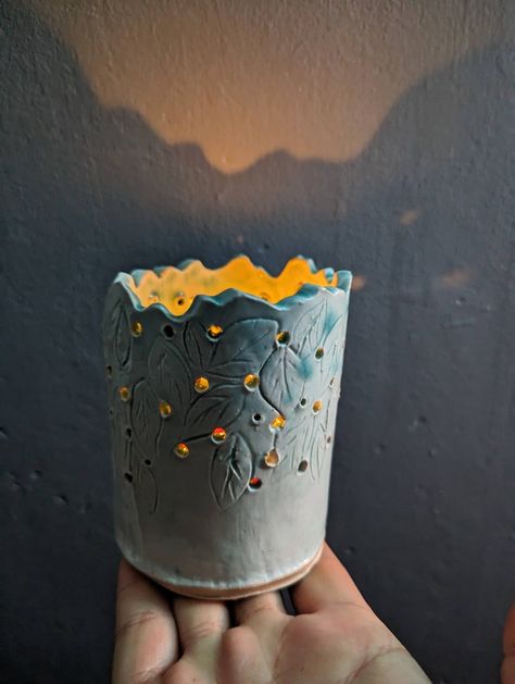 Ceramic slab work cylinder holes carved leaves Ceramic Luminary Handmade, Cylinder Pottery Ideas, Ceramic Portfolio, Ceramic Luminaries, Leaf Candle, Leaf Candle Holder, Candle Pot, Clay Classes, Pottery Candle Holder